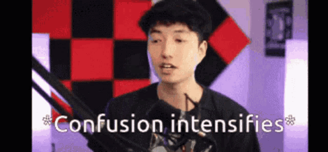 a man is standing in front of a microphone with the words confusion intensifies below him