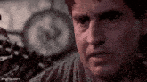 a close up of a man 's face in a dark room .