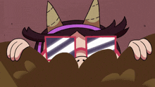 a cartoon character wearing sunglasses and horns looks out from behind a pile of dirt