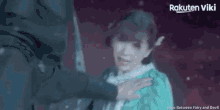a woman is being held by a man in a rakuten viki video