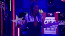 a woman is standing in front of a vip sign