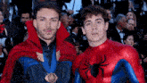 two men dressed as doctor strange and spider-man pose for a picture