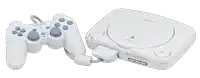 a white sony video game console with a controller attached to it