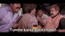 a group of men standing next to each other with the words tumhe kaise pata chala on the bottom