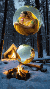 a painting of a woman in a yellow sari sitting by a campfire in the snow