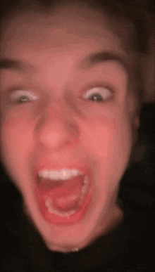 a woman making a funny face with her mouth open