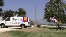 a white van with free candy written on the back