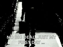a man is walking down a hallway with a suitcase and the words `` no big deal , just my first day . ''