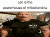 a man in a black shirt is standing in a room .