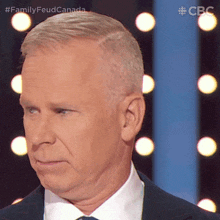 a close up of a man 's face with the hashtag familyfeud canada on the bottom