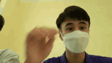 a man wearing a face mask that says kn95