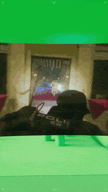 a green screen shows a police officer in a video game