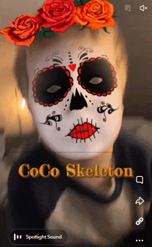 a person with a sugar skull face painted on their face