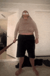 a man in a monkey costume holds a baseball bat