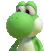 a close up of a green and white stuffed animal with a big mouth .