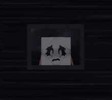 a cartoon drawing of a ghost with a sad face
