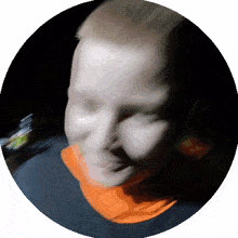 a blurry picture of a person 's face in a dark circle