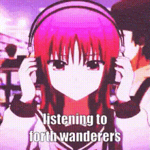 a girl with pink hair is listening to music with headphones .
