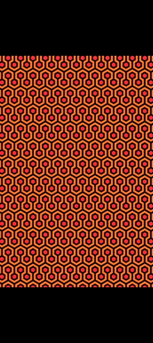 a pattern of red and orange hexagons on a black background
