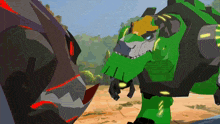 a green robot is standing next to a black robot with red teeth