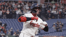 a baseball player wearing a uniform that says guardian
