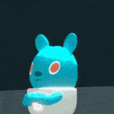 a blue cartoon character is sitting in a cup with a red heart above it
