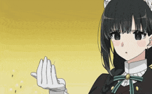 a girl in a maid outfit is holding her hand up