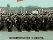 a group of soldiers marching in a line with the words zogen kampfend durch die halbe welt written below them