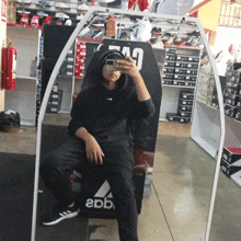 a man taking a picture of himself in a store