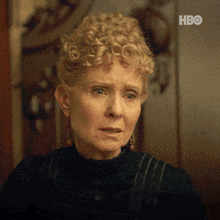 a close up of a woman 's face with hbo written on the bottom