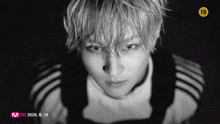 a black and white photo of a young man with the number 15 on it