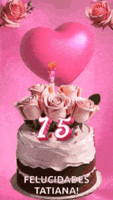 a birthday cake with roses and a heart on top and the number 15 on it