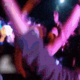 a blurry picture of people dancing with mlb written in the corner