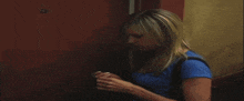 a blurry picture of a man opening a door with his hand
