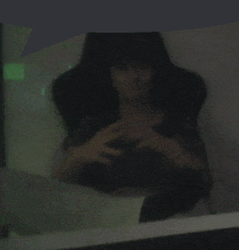 a blurred image of a person sitting in a bathtub
