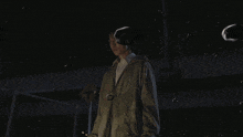 a statue of a man is lit up in the dark