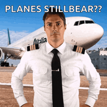 a pilot is standing in front of an airplane with the words " planes stillbear " above him