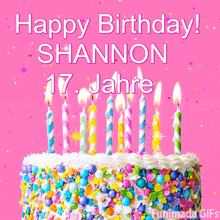 a birthday cake with candles and sprinkles says happy birthday shannon