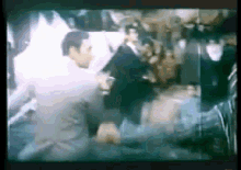 a blurry picture of a man in a suit