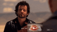 a man says you 're next to a picture of a sandwich