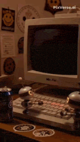 a mr. fun computer sits on a desk next to a can of coke