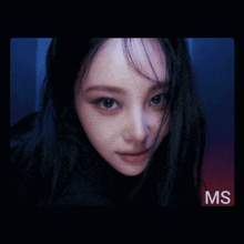 a close up of a woman 's face with the letters ms on the bottom right