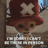 a stuffed animal wearing a red hat that says i 'm sorry i can 't be there in person on it