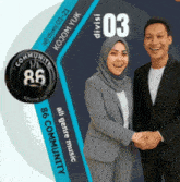 a man and a woman are shaking hands in front of a sign that says ' 86 community ' on it