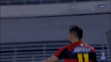 a player with the number 10 on their jersey is hugging another player