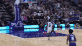 a basketball player with the number 2 on the back of his shorts