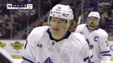 a hockey player wearing a jersey that says milk