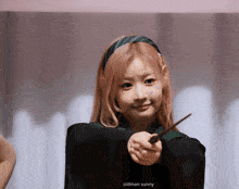 a girl with pink hair is holding a wand and the words oldman sunny are on the bottom of the image