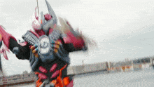 a blurred image of a person in a robot costume with the letter d on their chest