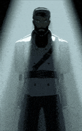 a man with a beard is standing in a dark room with a light behind him